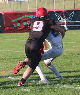 Ashton Martin with one of his two sacks against Valley.