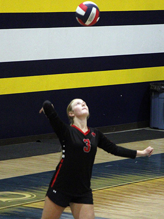 Erica Schlader serves for a point during the first set at Logos.